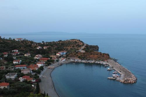 an aerial view of a harbor with boats in the water at Armenaki Apartments in Sampatiki
