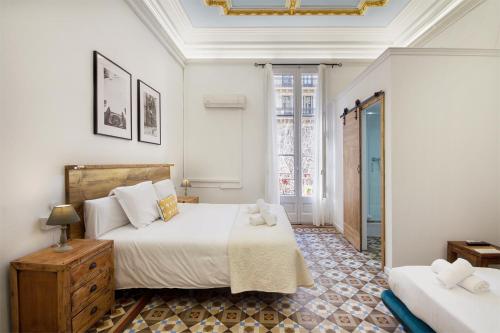 Postel nebo postele na pokoji v ubytování Hostal Girona