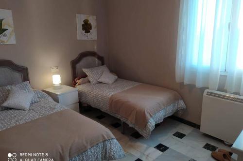 Ein Bett oder Betten in einem Zimmer der Unterkunft Casa escarpes de Trejo