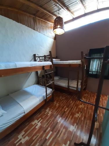 Una cama o camas en una habitación de The Weekend Hostal