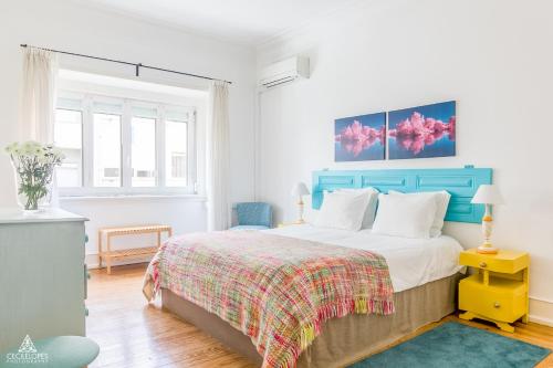 Uma cama ou camas num quarto em Casa da Avenida Lisboa