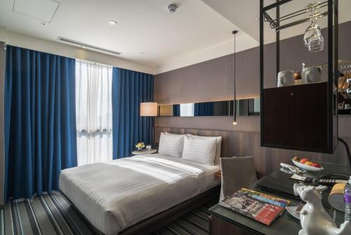 Postel nebo postele na pokoji v ubytování WESTGATE Hotel