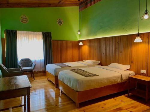 Letto o letti in una camera di Dzi Pema