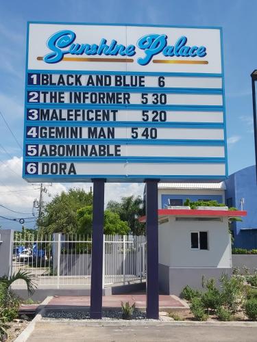 a large sign in front of a store at The Oasis I, Portmore Country Club in Portmore