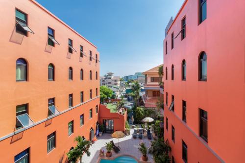 an aerial view of an alley between two buildings at Baansuanprannok Hotel in Bangkok