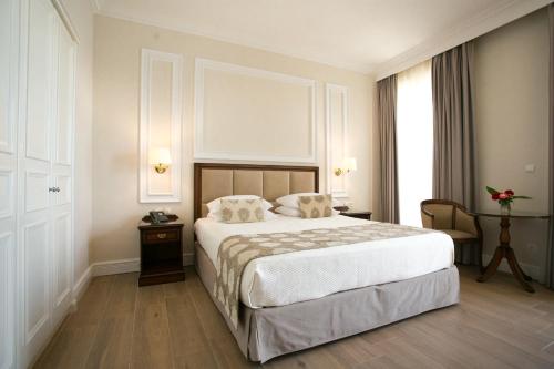 Кровать или кровати в номере Thermae Sylla Spa & Wellness Hotel