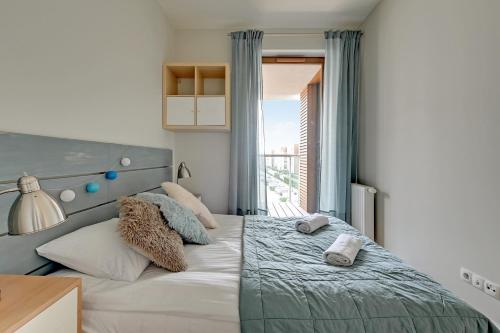 Ліжко або ліжка в номері Apartments RIVA - Nadmorski Dwór Premium