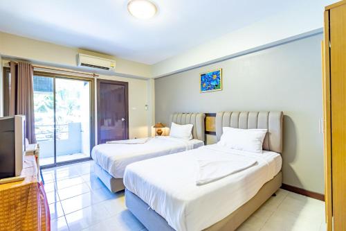 Кровать или кровати в номере Silver Gold Garden, Suvarnabhumi Airport