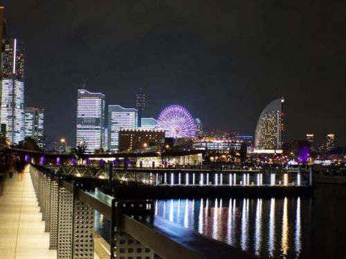 a view of a city skyline at night at Yokohama Sakuragicho Town Hotel in Yokohama
