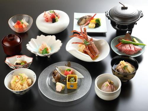 a group of plates of food on a table at Miyakojima Kurima Resort Seawood Hotel in Miyako Island