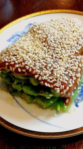 a sesame seed sandwich on a plate on a table at Jinjiang Metropolo Hotel Classic Nanjing Road (East) Shanghai in Shanghai