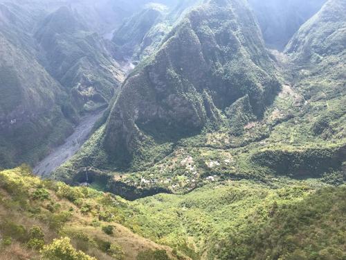 an aerial view of a mountain range with a valley at ti Kaz Papang in La Plaine des Cafres