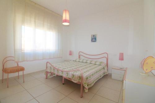 Giường trong phòng chung tại Rif. B12 - DELFINO 2