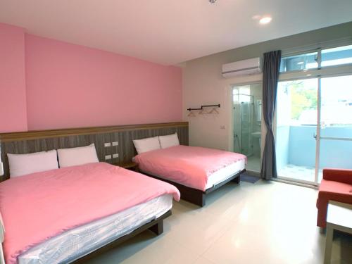 Ένα ή περισσότερα κρεβάτια σε δωμάτιο στο The Sunny Homestay