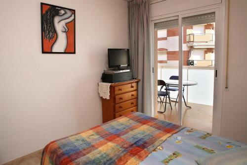 Ένα ή περισσότερα κρεβάτια σε δωμάτιο στο AT061 Cerca del centro, con piscina y a 5 min de la playa