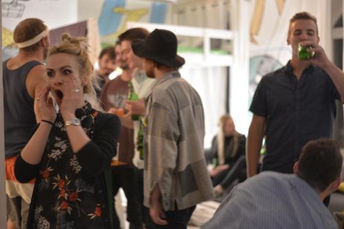 a woman talking on a cell phone in a crowd of people at Whole Wide World Hostel in Zagreb