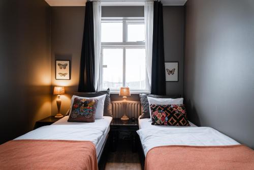 Ένα ή περισσότερα κρεβάτια σε δωμάτιο στο Hotel Leifur Eiriksson