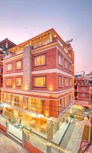 a building with a pool in front of it at Pema Boutique Hotel in Kathmandu