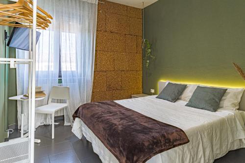 A bed or beds in a room at Lotus House