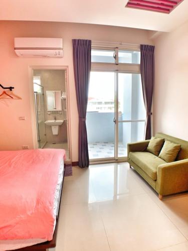 Ένα ή περισσότερα κρεβάτια σε δωμάτιο στο The Sunny Homestay