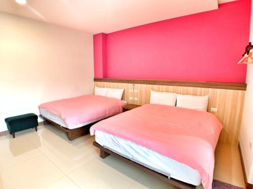 Ένα ή περισσότερα κρεβάτια σε δωμάτιο στο The Sunny Homestay