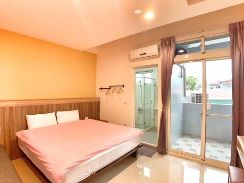 Ένα ή περισσότερα κρεβάτια σε δωμάτιο στο The Sunny Homestay
