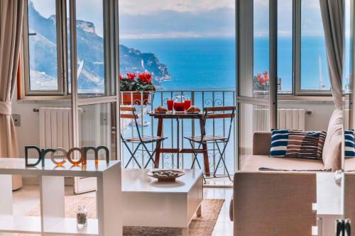 a living room with a view of the ocean at CASA CHIARINA breathtaking sea view in Ravello