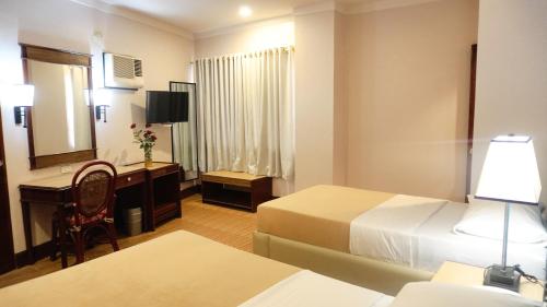 Postel nebo postele na pokoji v ubytování Hotel Valencia