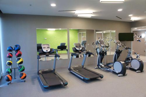 a gym with treadmills and ellipticals in a room at La Quinta Inn & Suites by Wyndham Braselton in Braselton