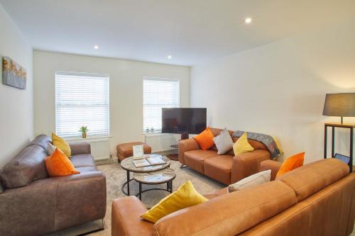 a living room with two couches and a tv at Host & Stay - Lemonade Arch in Whitby