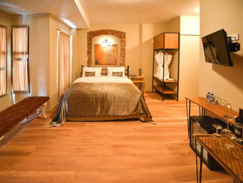 En eller flere senger på et rom på Maravilloso Hotels Vintage