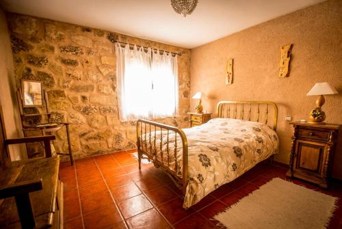 מיטה או מיטות בחדר ב-Casa La Escondida