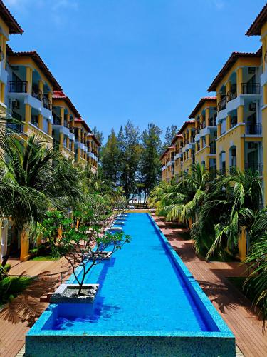 a swimming pool in the middle of a resort at Le'Coco Homestay in Tiara Desaru Residence in Desaru