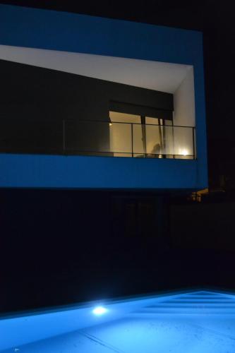 a building with a window with a person in it at Casa do Mouro in Lousã