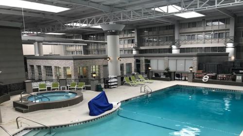 a large swimming pool in a large building at Holiday Inn Chicago North Shore by IHG in Skokie