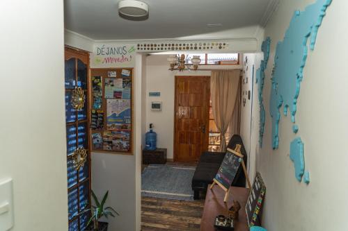 a hallway with a living room and a living room with a room at Hostel Punto Cavancha in Iquique
