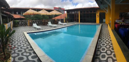 A piscina localizada em Hotel Pousada Dos Ventos ou nos arredores