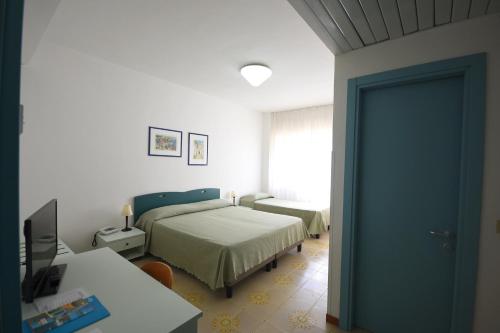 Ένα ή περισσότερα κρεβάτια σε δωμάτιο στο Grand Hotel Delle Terme