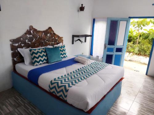 Katil atau katil-katil dalam bilik di Blue Coral Homestay