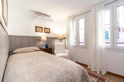 A bed or beds in a room at Ca' Terrazza di Marco Polo