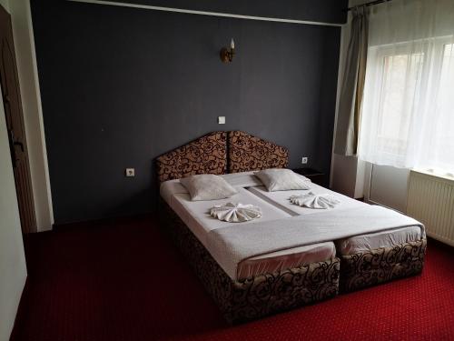 Postel nebo postele na pokoji v ubytování Golden Pension