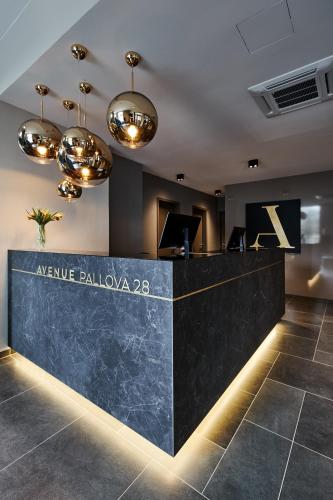 a lobby of a hotel with a reception desk at Avenue Pallova 28 in Plzeň