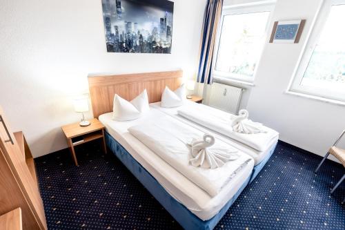 
Кровать или кровати в номере Hotel Fresh INN
