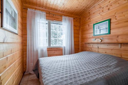 Postel nebo postele na pokoji v ubytování Lomaperkkiö Apartments