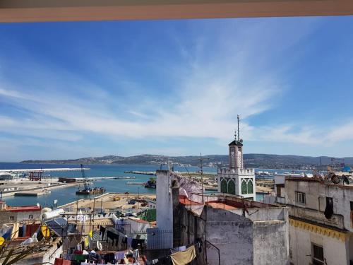 a view of a city with a clock tower at Palais Zahia Hotel & Spa in Tangier