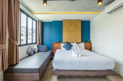 a hotel room with two beds and a window at W Station in Bangkok
