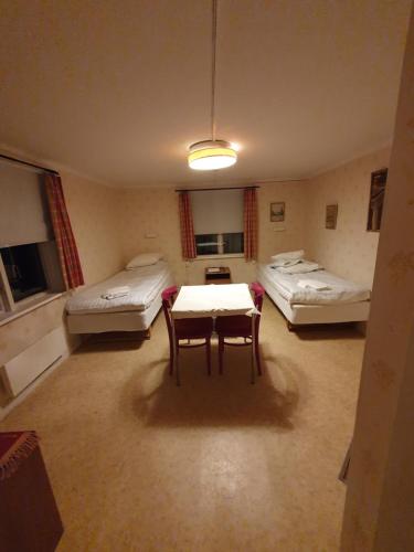 Ένα ή περισσότερα κρεβάτια σε δωμάτιο στο Hotell & Konferens Loftet