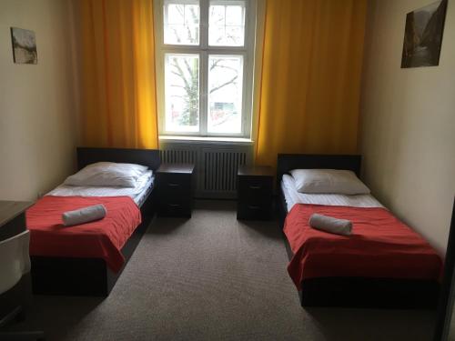 Llit o llits en una habitació de Hostel Centrum