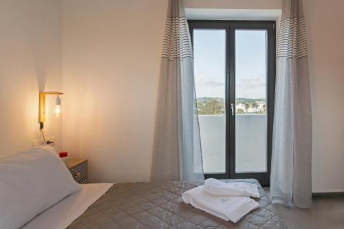 Katil atau katil-katil dalam bilik di Vastblue of Paros