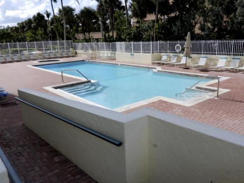 a large swimming pool in a building at Gorgeous views that stretch forever right from your very own private balcony! in Marco Island